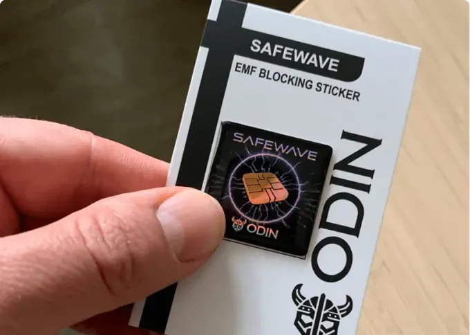 ODIN SafeWave EMF Blocking Sticker retail packaging held in a hand